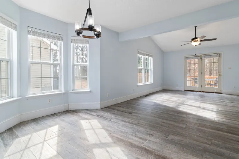 Bright renovated room with new walls, windows and flooring